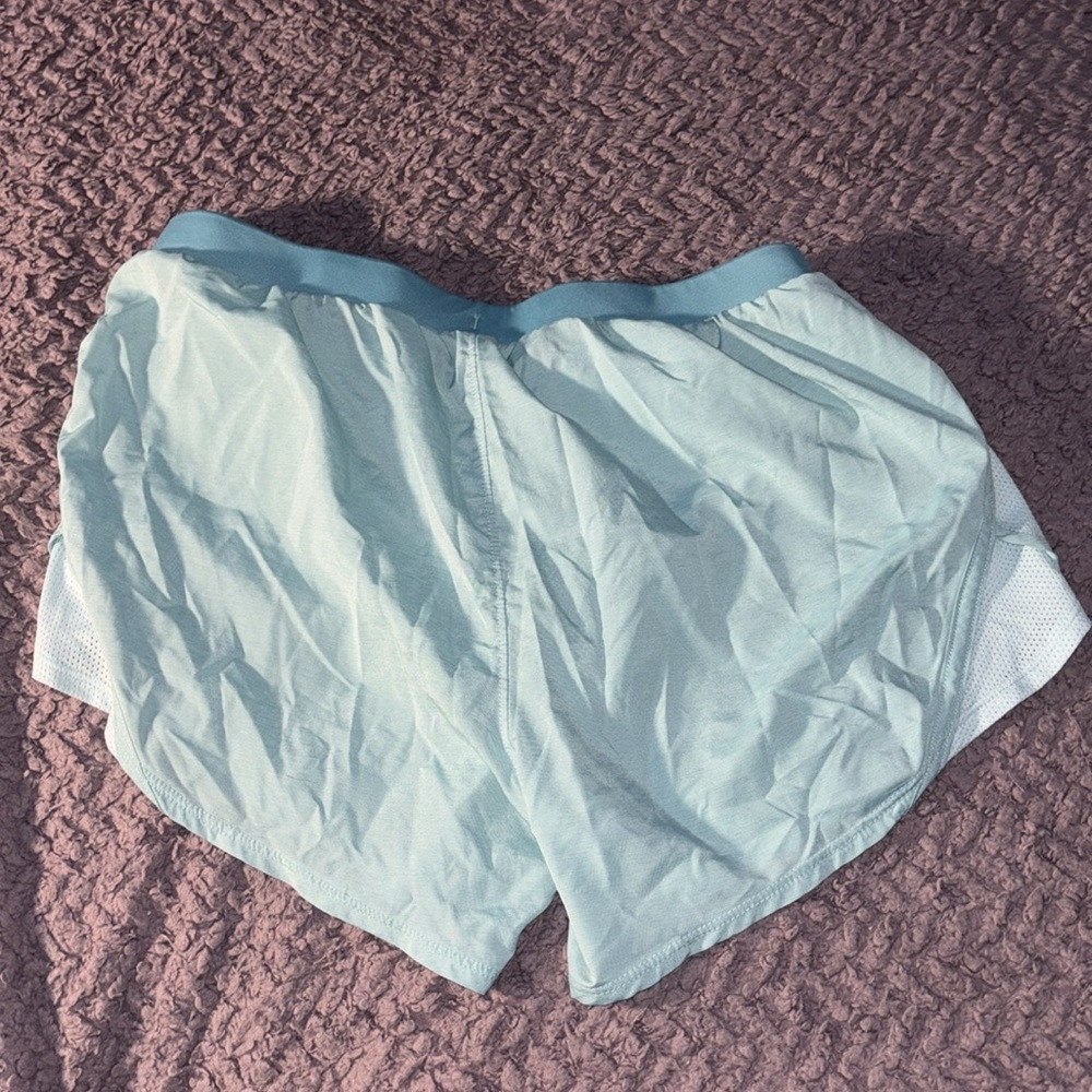 2 pairs of Under Armor running shorts. Size small. - Picture 4 of 5